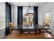 Dining room featuring a wooden table, wooden chairs, natural light and navy blue curtains at 11014 Woodpark Dr, Noblesville, IN 46060