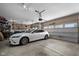Garage view featuring a white car parked inside, highlighting the spaciousness and functionality at 11014 Woodpark Dr, Noblesville, IN 46060