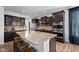 Kitchen with an island, stainless steel appliances, and wood cabinets with granite countertops at 11014 Woodpark Dr, Noblesville, IN 46060