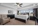 Comfortable bedroom with a neutral color palette, a ceiling fan, and ample natural light at 11014 Woodpark Dr, Noblesville, IN 46060