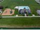 A community space featuring a swimming pool, playground, and pool house, ideal for Gathering activities and relaxation at 11014 Woodpark Dr, Noblesville, IN 46060