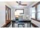 Home office with black desk, wood trim, natural light and ceiling fan at 1116 N Linwood Ave, Indianapolis, IN 46201