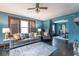 Bright living room featuring a decorative sofa, fireplace and archway to dining room at 1116 N Linwood Ave, Indianapolis, IN 46201
