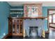Living room fireplace with brick and glass features, adding warmth and character to the room at 1116 N Linwood Ave, Indianapolis, IN 46201