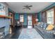 Inviting living room with a decorative fireplace, stylish sofa, and ample natural light at 1116 N Linwood Ave, Indianapolis, IN 46201