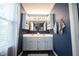 Stylish bathroom featuring a double sink vanity, mirrored cabinets and modern fixtures at 1123 Barley Cir, Carmel, IN 46032