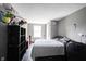 Bedroom with a bed, desk, and storage unit with dark wood floors at 1123 Barley Cir, Carmel, IN 46032