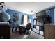 Bedroom featuring blue walls, hard wood floors, a desk, and a large storage unit at 1123 Barley Cir, Carmel, IN 46032