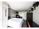 Bedroom featuring a gray wall, desk, bed, and dark floors at 1123 Barley Cir, Carmel, IN 46032