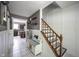 Warm entryway featuring modern accents, tiled floors, and a staircase with patterned treads at 1123 Barley Cir, Carmel, IN 46032