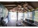 Gazebo with seating, a ceiling fan, a glass table, and privacy curtains at 1123 Barley Cir, Carmel, IN 46032