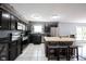 Modern kitchen featuring stainless steel appliances, a large island, and ample cabinet space at 1123 Barley Cir, Carmel, IN 46032