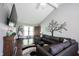 Relaxing living room with a large gray sectional and decorative tree wall art at 1123 Barley Cir, Carmel, IN 46032