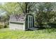 Exterior of backyard storage shed with white doors and a concrete ramp at 1123 Barley Cir, Carmel, IN 46032