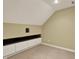 Neutral attic space featuring large storage cabinets and carpet floors at 12304 Ridgeside Rd, Indianapolis, IN 46256