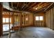 Unfinished basement with open ceiling, waiting for transformation into a customized space at 12304 Ridgeside Rd, Indianapolis, IN 46256