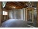 Unfinished basement with visible framing, ready for customization and personalized design at 12304 Ridgeside Rd, Indianapolis, IN 46256