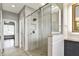 Bathroom showcasing glass shower with tile, and vanity with granite countertop and storage space at 12304 Ridgeside Rd, Indianapolis, IN 46256