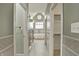 This bathroom features stylish tile work, a glass shower, and a luxurious soaking tub at 12304 Ridgeside Rd, Indianapolis, IN 46256