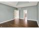 This bedroom features gorgeous hardwood floors, vaulted ceilings, and access to the Primary bath at 12304 Ridgeside Rd, Indianapolis, IN 46256