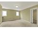 Bedroom with a large window, neutral walls, and carpet floors at 12304 Ridgeside Rd, Indianapolis, IN 46256