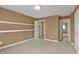 Neutral bedroom space with two doorways, base trim, and carpet floors at 12304 Ridgeside Rd, Indianapolis, IN 46256