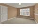 Neutral bedroom featuring a large window that brings in natural light at 12304 Ridgeside Rd, Indianapolis, IN 46256