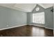 Spacious primary bedroom offers hardwood floors, a vaulted ceiling, and a large window at 12304 Ridgeside Rd, Indianapolis, IN 46256