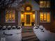 Charming front entrance with elegant columns and a well-maintained walkway, surrounded by snow-covered landscaping at 12304 Ridgeside Rd, Indianapolis, IN 46256