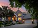 Stunning brick home featuring a landscaped front yard and attached three-car garage at 12304 Ridgeside Rd, Indianapolis, IN 46256