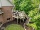 Spacious deck features outdoor grill, stair access to the yard, and lovely backyard views at 12304 Ridgeside Rd, Indianapolis, IN 46256
