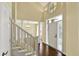 Elegant foyer with hardwood floors, soaring ceilings, and a grand staircase at 12304 Ridgeside Rd, Indianapolis, IN 46256