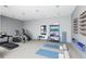 Well-equipped home gym with modern exercise machines, yoga mats, and ample space for a complete workout routine at 12304 Ridgeside Rd, Indianapolis, IN 46256