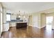Spacious kitchen with hardwood flooring, a center island, stainless steel appliances, and modern cabinetry at 12304 Ridgeside Rd, Indianapolis, IN 46256