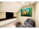 Cozy media room with entertainment center, modern art, and comfortable seating at 12304 Ridgeside Rd, Indianapolis, IN 46256
