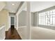 Spacious open living room with large windows, columns, and neutral carpeting at 12304 Ridgeside Rd, Indianapolis, IN 46256