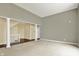 Open-concept living room with large windows, staircase and columns, bright space at 12304 Ridgeside Rd, Indianapolis, IN 46256