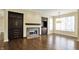 Bright living room features a fireplace, built-in cabinets and large windows that let in a lot of natural light at 12304 Ridgeside Rd, Indianapolis, IN 46256