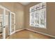 Office or den with french doors and a large window offering natural light at 12304 Ridgeside Rd, Indianapolis, IN 46256