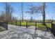 Well-maintained backyard with wood deck and black metal railings and landscaped yard at 12536 Lowery Way, Fishers, IN 46037