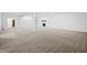 Open basement area with recessed lighting, fireplace, and carpeted flooring at 12536 Lowery Way, Fishers, IN 46037