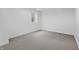 Clean, unfinished basement with small window and neutral colored carpeted floor at 12536 Lowery Way, Fishers, IN 46037