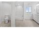 Bright bathroom with walk in shower, bathtub and modern vanity next to a large window at 12536 Lowery Way, Fishers, IN 46037