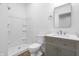 Modern bathroom with a walk-in shower, vanity sink, and sleek mirror at 12536 Lowery Way, Fishers, IN 46037