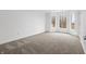 Bright bedroom with neutral carpet and large window framing an outside view at 12536 Lowery Way, Fishers, IN 46037
