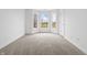 Bright bedroom with neutral carpet and large window offering expansive outdoor views at 12536 Lowery Way, Fishers, IN 46037
