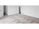 Bright bedroom with neutral carpet, white walls, open closet, and connecting bathroom at 12536 Lowery Way, Fishers, IN 46037