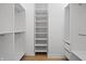 Walk-in closet with custom shelving and hardwood floors at 12536 Lowery Way, Fishers, IN 46037