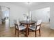 This elegant dining area boasts great natural light, hardwood floors, and white decor at 12536 Lowery Way, Fishers, IN 46037