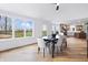 Dining room featuring a dark table with seating for six with views to backyard at 12536 Lowery Way, Fishers, IN 46037